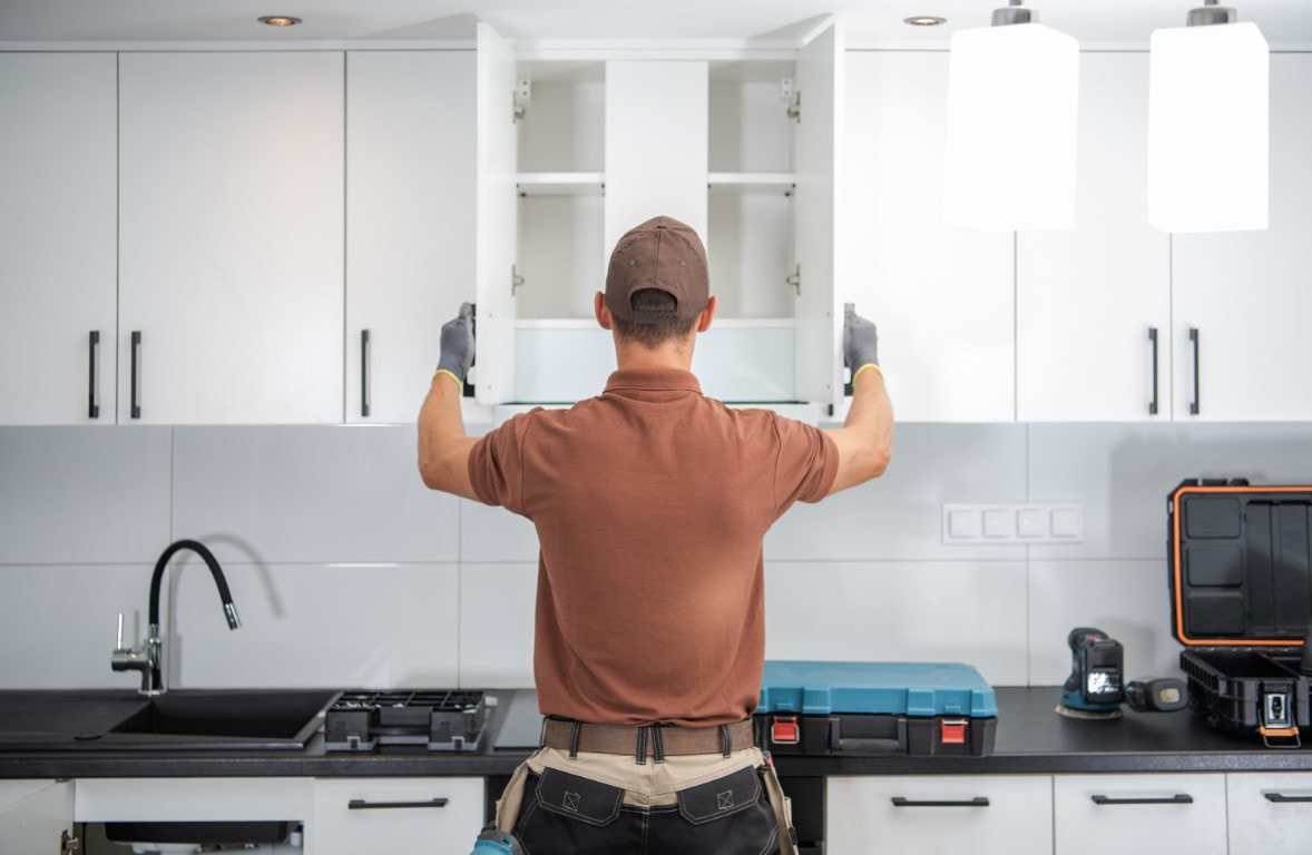 Worker opening a cabinet